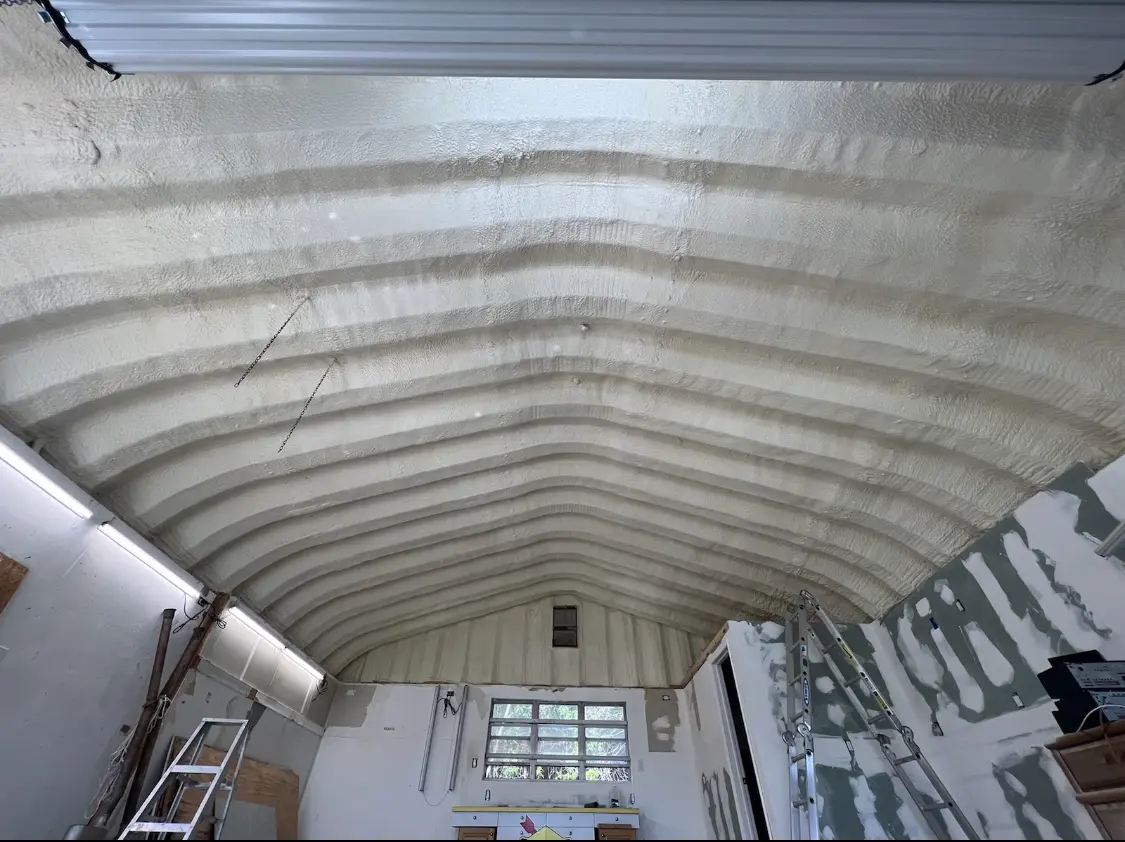 Spray polyurethane foam applied to the underside of a metal roof deck in Riverbank
